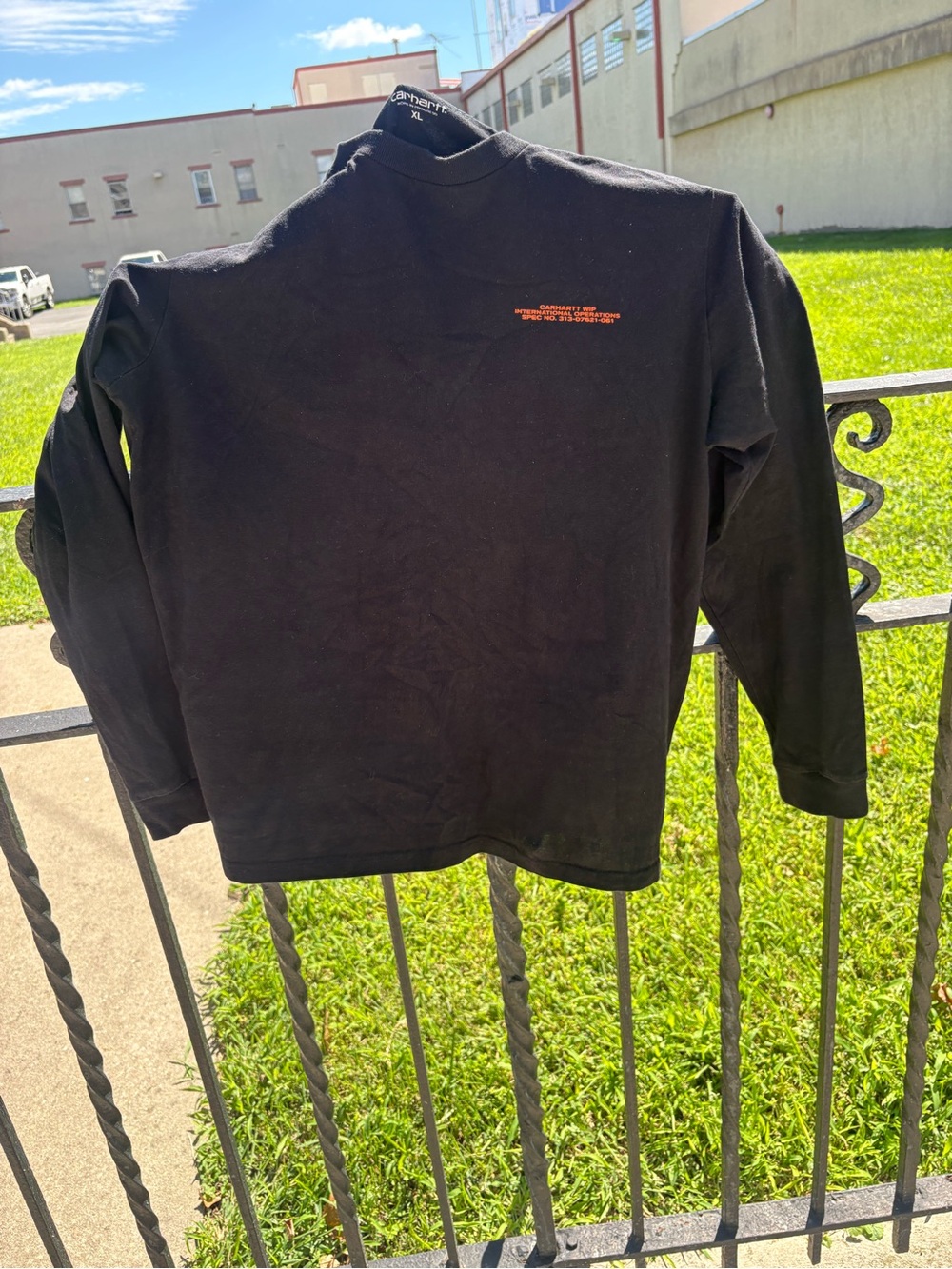 Carhartt WIP mens Black Long-Sleeve Tee with Small Orange